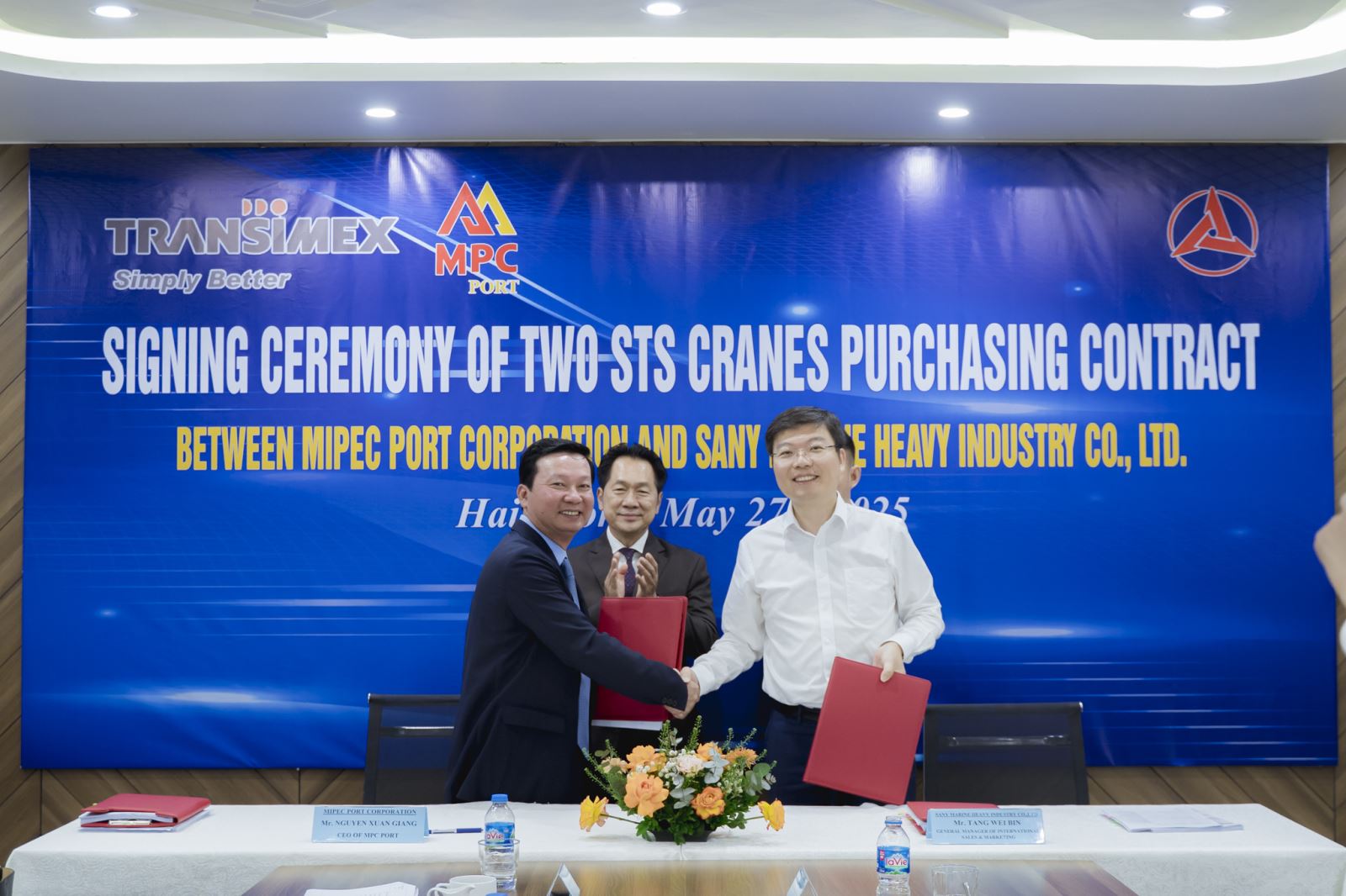 A group of men shaking handsAI-generated content may be incorrect.